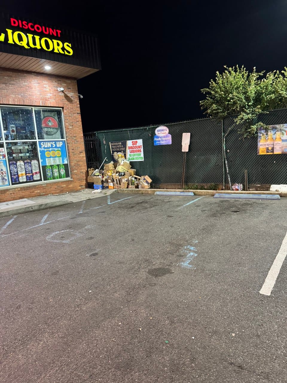 Faded and worn ADA parking lot markings showing common compliance violations in a New Jersey commercial lot