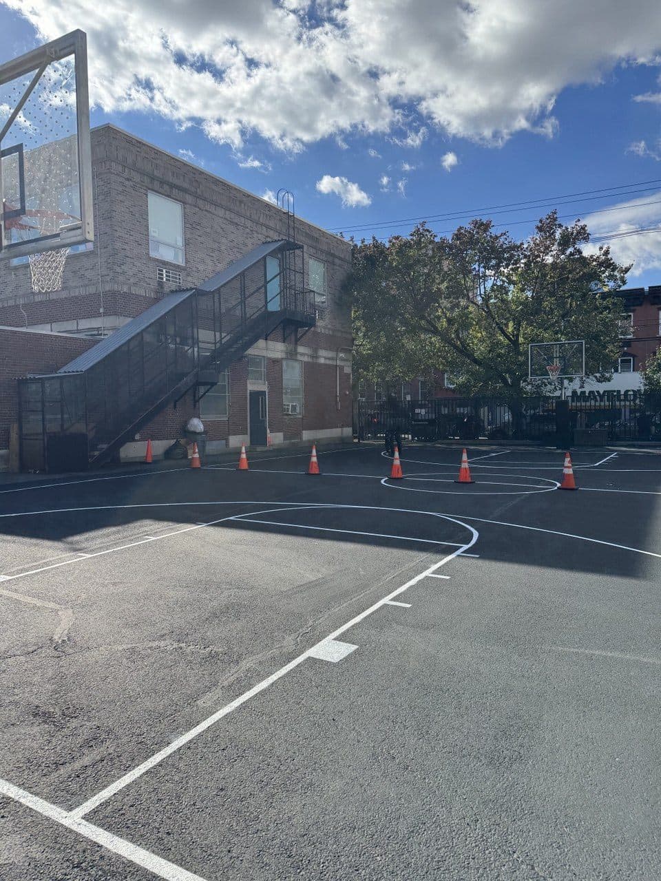 Finished community basketball court with crisp markings at the Hoboken Boys & Girls Club