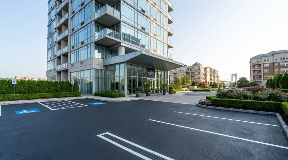 Professional sealcoating work on a Fort Lee property showing premium pavement protection